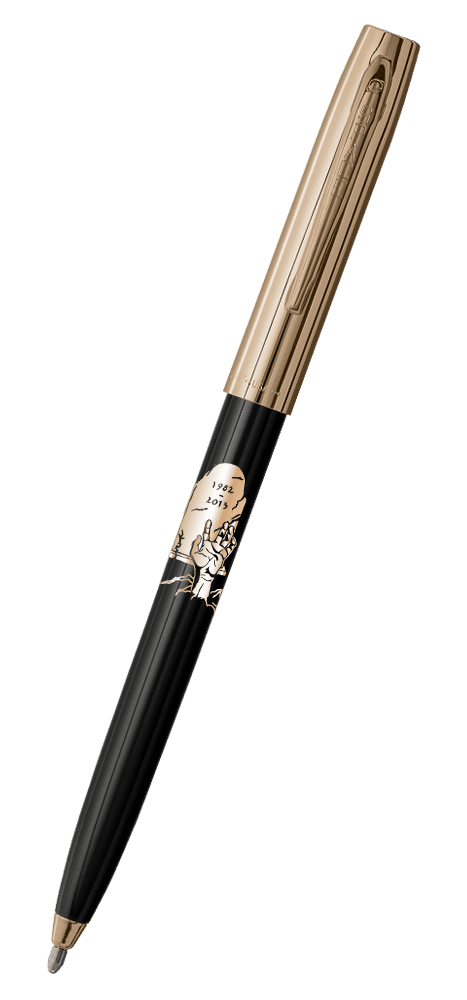 Cap-o-matic space pen with black plastic barrel, gold cap with clip, gold tip, and imprinted gold headstone and zombie hand.