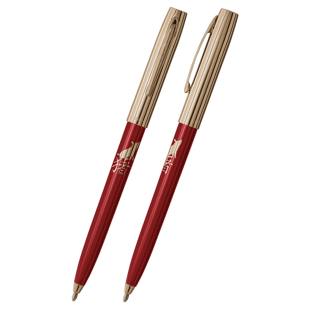 Front and side views of cap-o-matic space pen with red plastic barrel, gold colored cap with clip, gold colored tip, and imprinted gold Chinese character and pig.