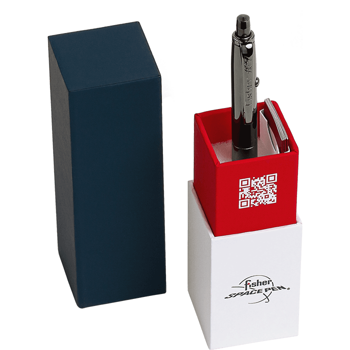 AG7-BTN-AXM in its gift box. The bottom of the box is white with the Fisher Space Pen logo. The pen is inserted into the red portion that is imprinted with the Fisher Space Pen QR code. The top of the box is dark blue.