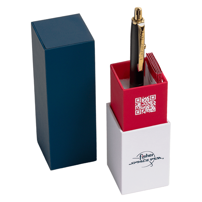 AG7H-146/GTN in its gift box. The bottom of the box is white with the Fisher Space Pen logo. The pen is inserted into the red portion that is imprinted with the Fisher Space Pen QR code. The top of the box is dark blue.